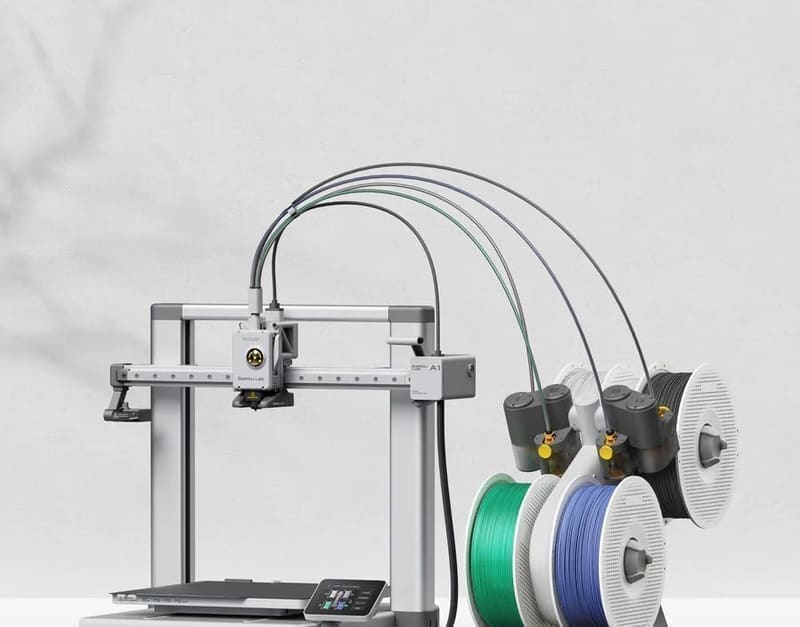 Bambu Lab A1 Combo product render showing the full-size A1 3D printer alongside the four-spool AMS Lite multi-colour filament changer in white aluminium frame