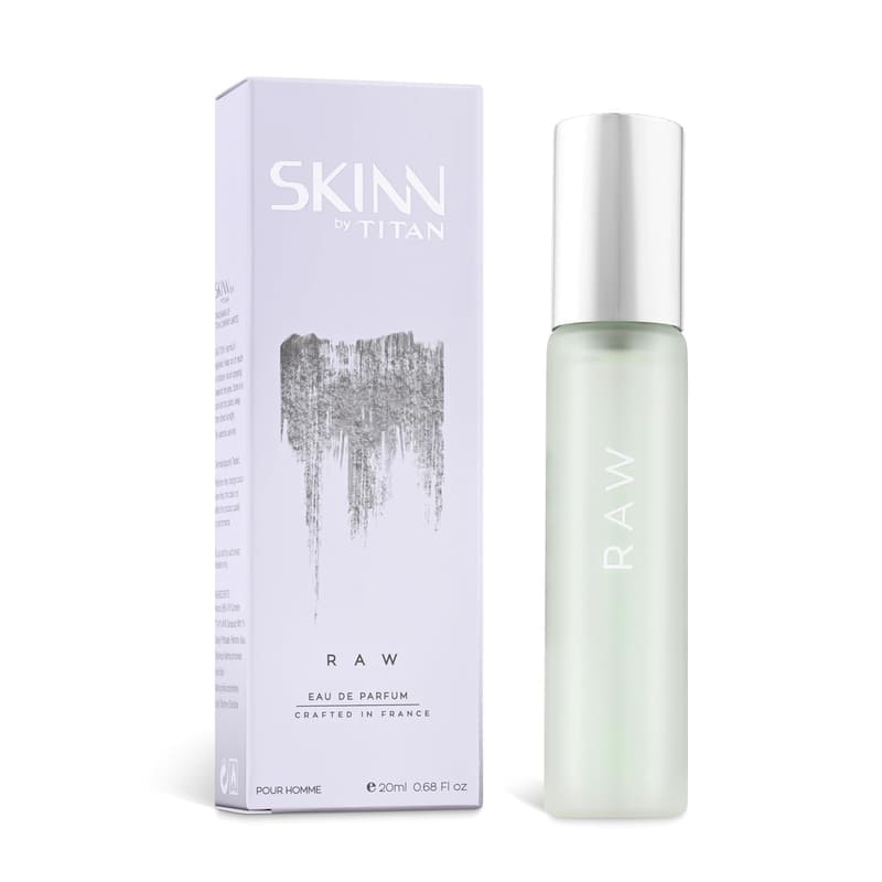 Skinn by Titan Raw 20ml Eau de Parfum frosted green bottle beside its lilac box marked Crafted in France