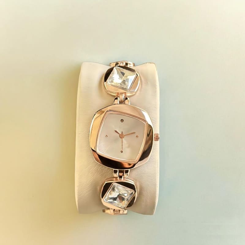 Styledose KC 27 women's watch front view with square case and stone-studded rose gold bracelet